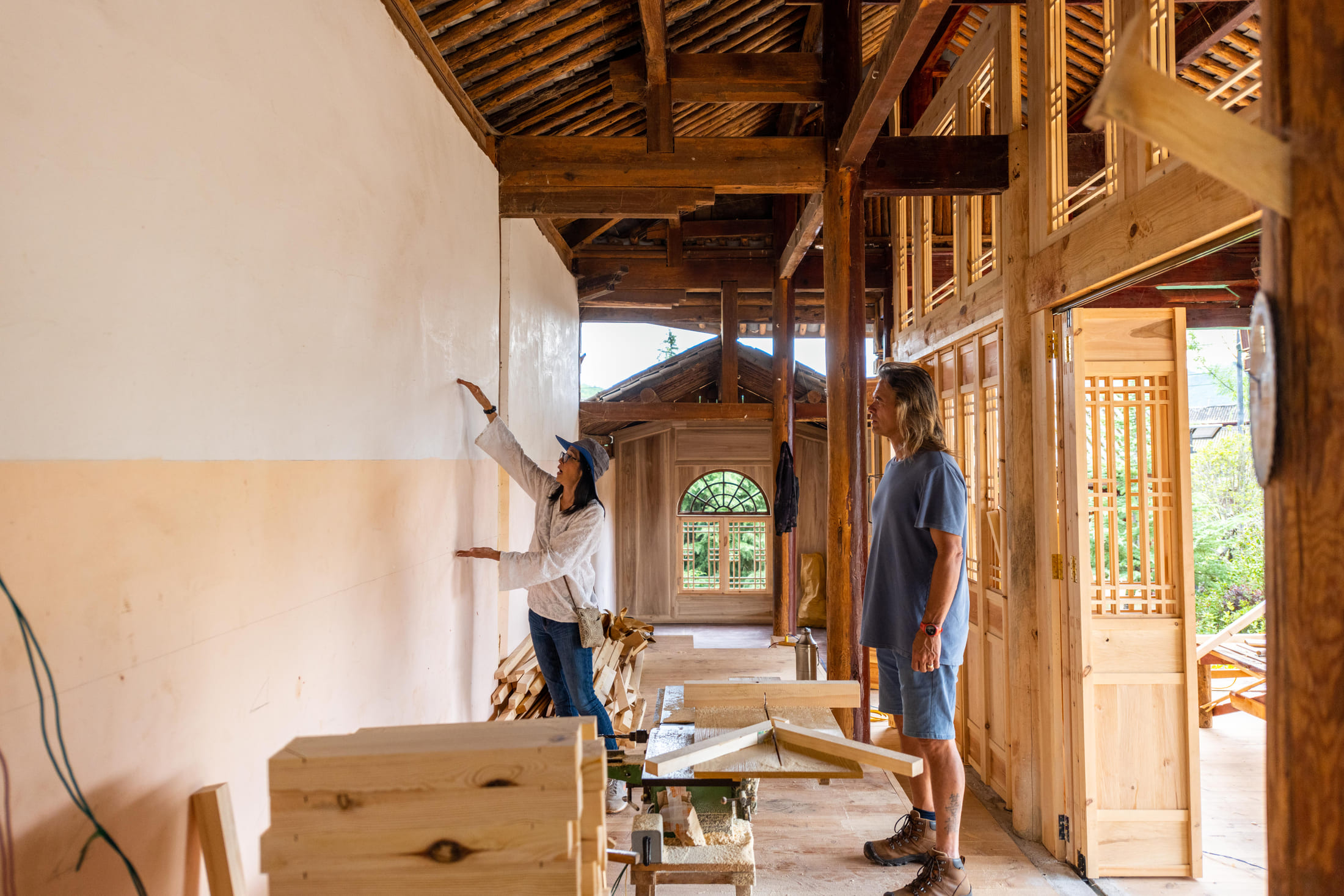 Brian Linden and Jeanee Linden review the design of a rural library in Shilong Village, Yunnan Province